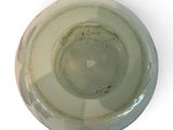 a white plate with a black writing on it