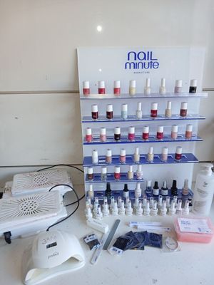 a display of nail polish bottles and tools on a counter