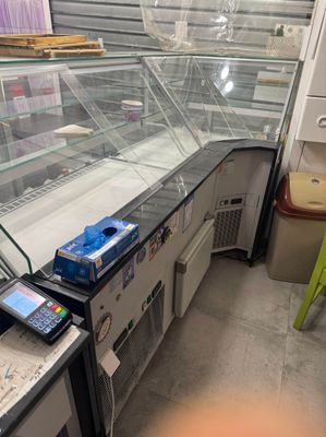 a glass display case in the middle of a store