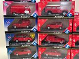 several boxes of red toy cars are stacked on top of each other