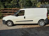 a white van that is parked on the side of the road