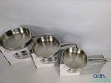 three stainless steel bowls are sitting on top of a box