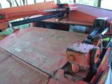 a red crane that is sitting in the back of a truck