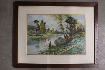 framed picture of a painting of a river and trees in a wood frame