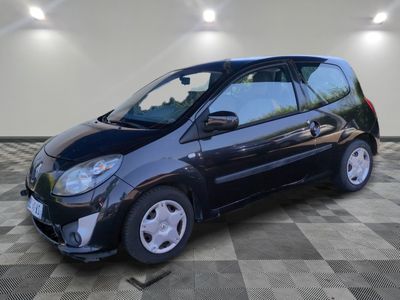 a picture of a small black car on a checkered floor