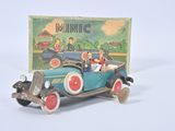 a small toy car with a picture of a man driving it