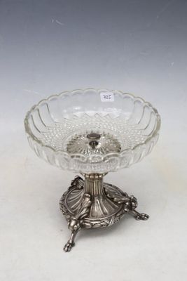 an antique silver plate with a turtle on it on a stand