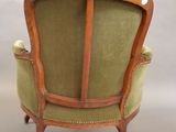 an image of a chair with a green upholstered back