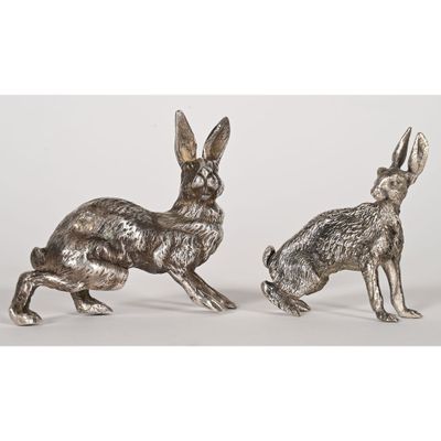 a pair of pewed metal rabbits
