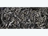 black and white painting of a bunch of skulls on a wall