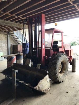 a forklift that is parked in a garage