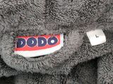 a stuffed elephant that has a tag on it ' s back