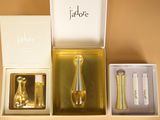 a box with a bottle, spoon, and other items inside of it