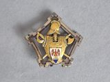 a close up of a badge on a table with a white background