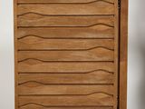 a close up of a wooden chest of drawers on a white background