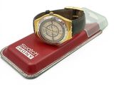 a watch sitting on top of a case on a white surface
