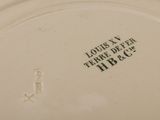 a close up of a plate with a name on it