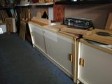 a kitchen that has a stove and cabinets in it