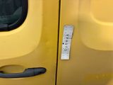 a sticker on the door handle of a yellow truck