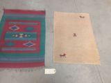 two rugs sitting on the floor next to each other