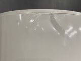 a close up of a white toilet with a black background