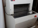 a machine that is sitting on the floor in the kitchen