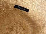 an image of a close up of a straw hat on a table