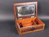 a small wooden box with a mirror inside of it