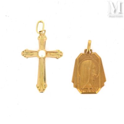 two small gold crosses and a small gold cross on a white background