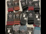 several pairs of men ' s socks sitting on top of each other