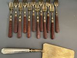 a lot of forks and spoons that are on the table