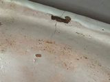a dirty sink in a dirty bathroom with a dirty faucet