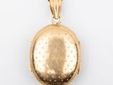 a close up of a gold locke on a white background
