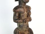 a close up of a statue of a woman holding a baby