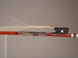 a violin bow with a string attached to it