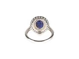 an image of a diamond and sapphire ring on a white background
