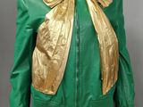 green and gold leather jacket with gold bow