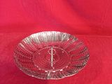 a close up of a glass plate with a monogram on it