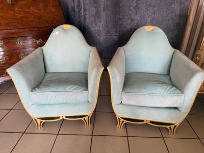 pair of mid - century style chairs in blue velvet with gold trim