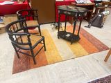 two chairs and a table in the middle of a room