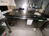 stainless steel counter tops in a commercial kitchen with a lot of counter space