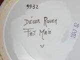 a close up of a plate with a name on it
