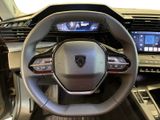 the interior of a car with a steering wheel and dashboard controls