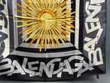 a black and white banner with a sun on it