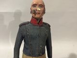 an image of a figurine of a man with a nose ring