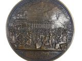 an image of a bronze medal with a picture of a crowd