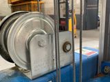 a close up of a machine with a chain attached to it