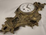 a clock that is sitting on a white table