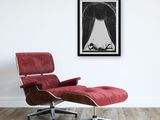 an image of a red chair and ottoman in a white room
