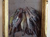 a picture of a painting of birds hanging on a wall
